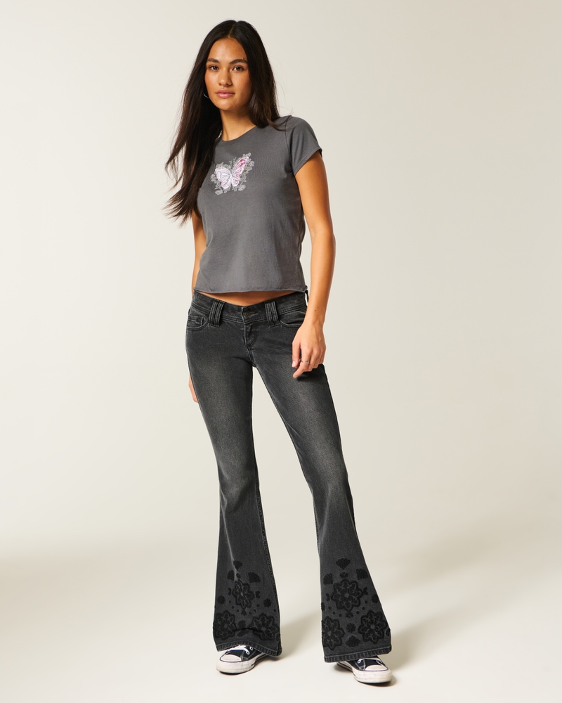 schwarz gewaschene ausgestellte jeans mit niedrigem bund und floraler stickerei