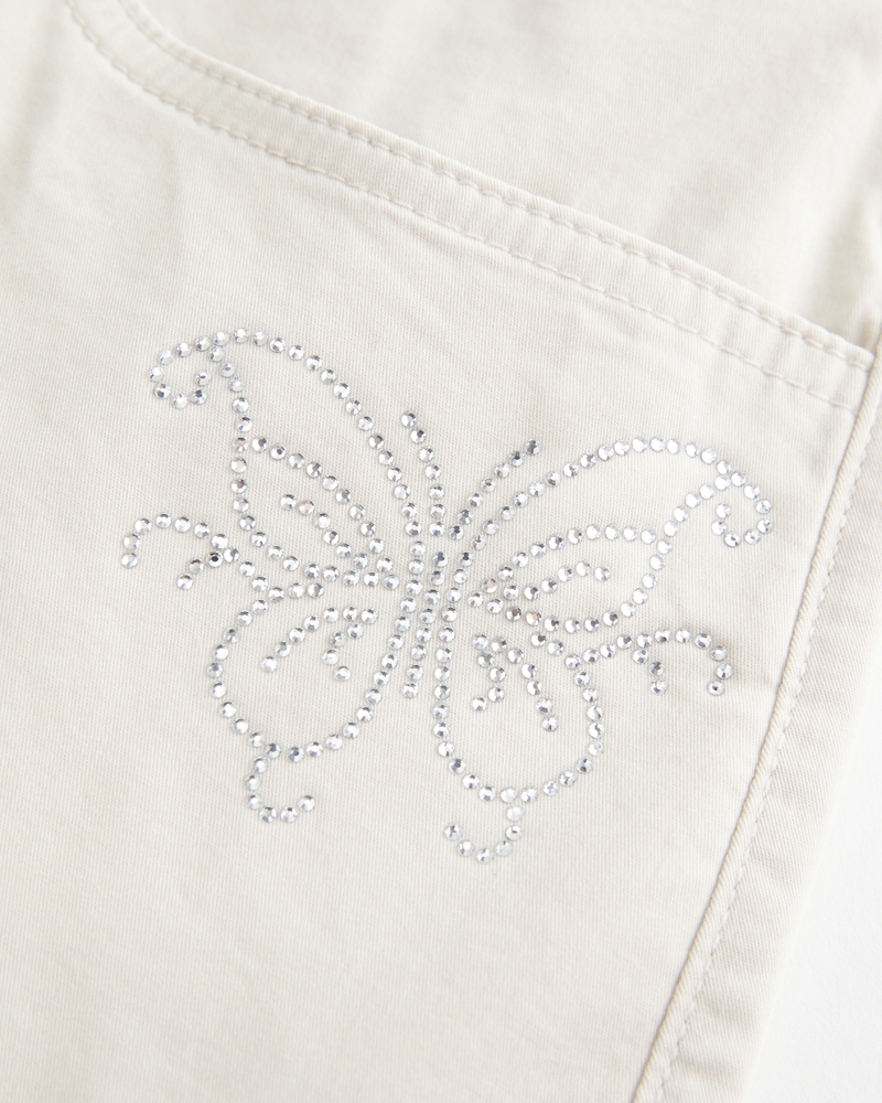 hüftig geschnittener glitzernder schmetterlings-twill-minirockminihose